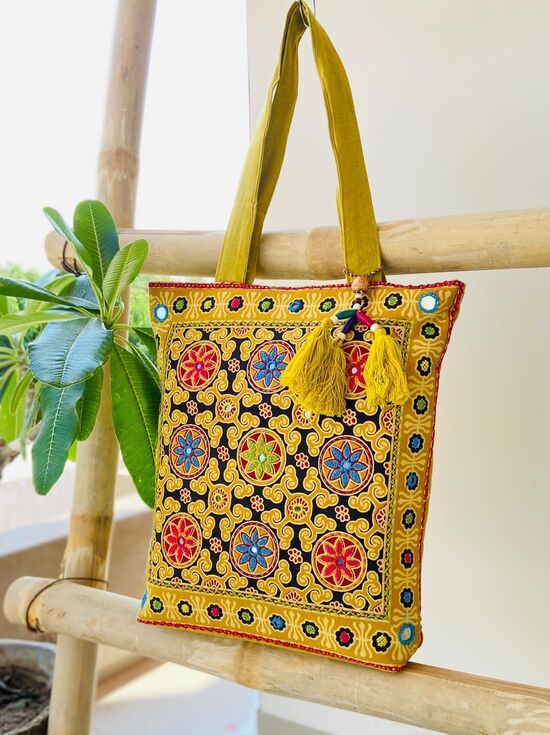 Ajrakh Handbag With Embroidery Mirror Work In Yellow Colour